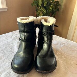 UGG brown leather shearling lace-up ankle boots.
